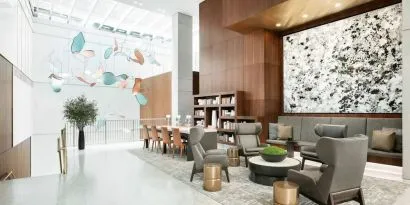 Lobby workspace and lounge area at AC Hotel New York Times Square.