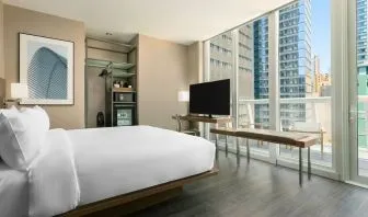 Day use room with work desk, balcony and private bathroom at AC Hotel New York Times Square.