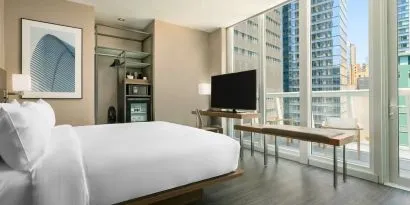 Day use room with work desk, balcony and private bathroom at AC Hotel New York Times Square.