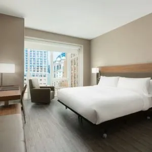 Day use room with workspace, large windows and private bathroom at AC Hotel New York Times Square.