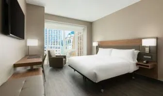 Day use room with workspace, large windows and private bathroom at AC Hotel New York Times Square.