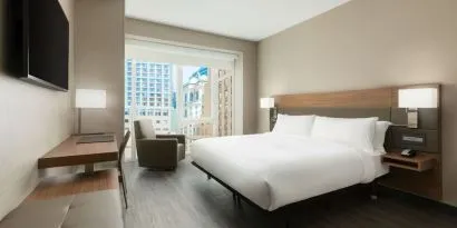 Day use room with workspace, large windows and private bathroom at AC Hotel New York Times Square.