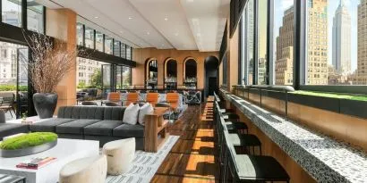 Lounge area with comfortable seating, perfect for coworking at AC Hotel New York Times Square.