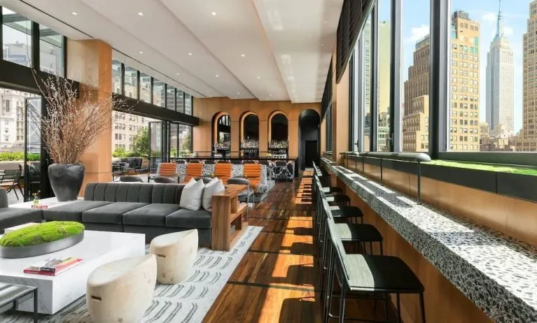 Lounge area with comfortable seating, perfect for coworking at AC Hotel New York Times Square.