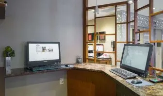 Business center with computers and printer at Hampton Inn Manhattan Chelsea.