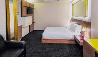 King room with workspace, lounge seating and private bathroom at Hotel Shocard NYC.