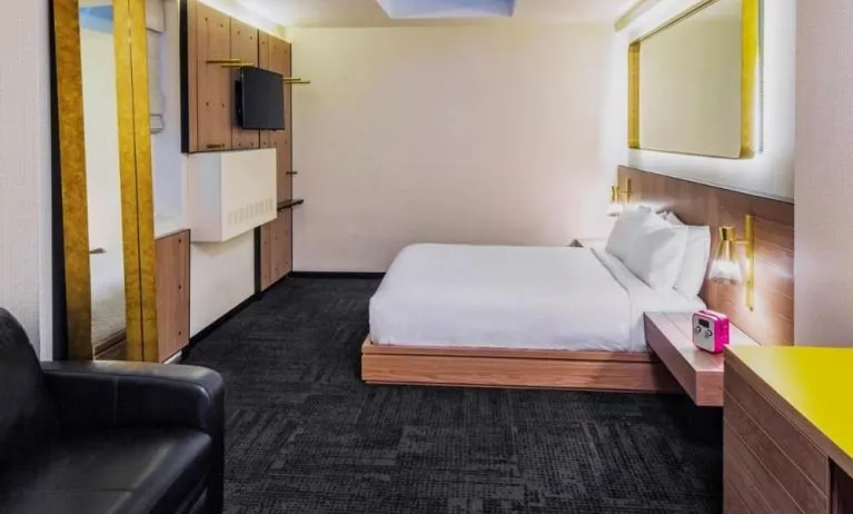 King room with workspace, lounge seating and private bathroom at Hotel Shocard NYC.