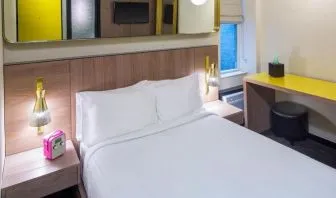 Day use room with king bed, work desk and private bathroom at Hotel Shocard NYC.