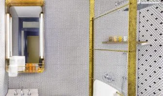 Private guest bathroom with shower and free toiletries at Hotel Shocard NYC.