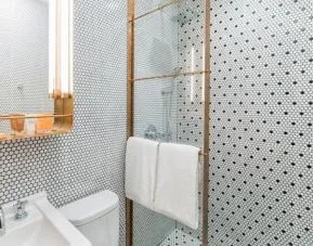 Private guest bathroom with shower at Hotel Shocard NYC.
