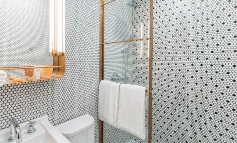 Private guest bathroom with shower at Hotel Shocard NYC.