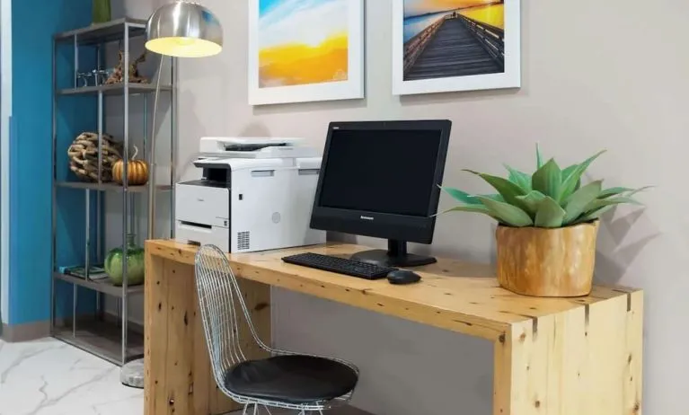 Business center with computer and printer at Days Inn By Wyndham Staten Island.