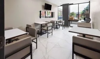 Dining area with comfortable seating, perfect for co-working at Days Inn By Wyndham Staten Island.