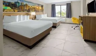 Day use twin room with work desk and private bathroom at Days Inn By Wyndham Staten Island.