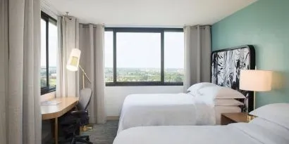 Day use twin room with work desk and private bathroom at Sheraton Miami Airport Hotel.