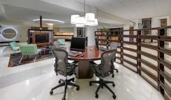 Business center with computers, printer and ergonomic chairs at Sheraton Miami Airport Hotel.