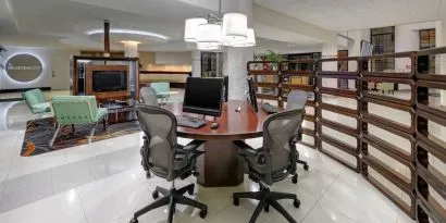 Business center with computers, printer and ergonomic chairs at Sheraton Miami Airport Hotel.