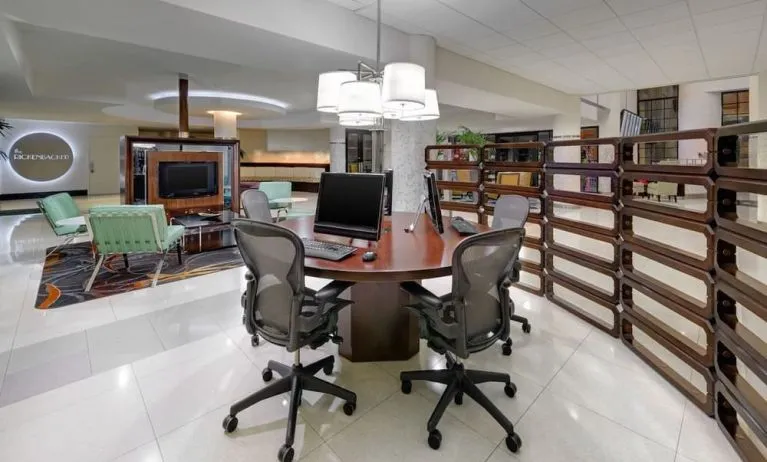 Business center with computers, printer and ergonomic chairs at Sheraton Miami Airport Hotel.