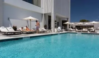 Outdoor pool with lounge chairs at EB Hotel Miami.