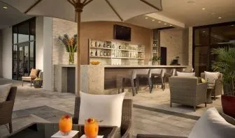 Hotel bar at the terrace with comfortable seating at EB Hotel Miami.