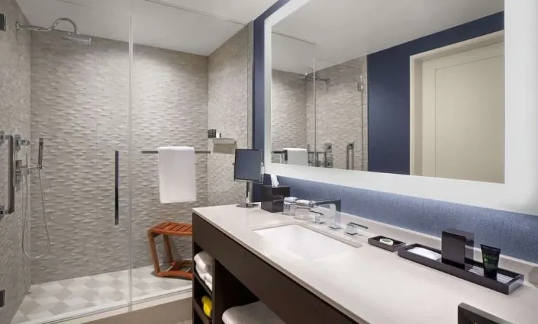Private guest bathroom with shower and free toiletries at Hyatt Centric Brickell Miami.