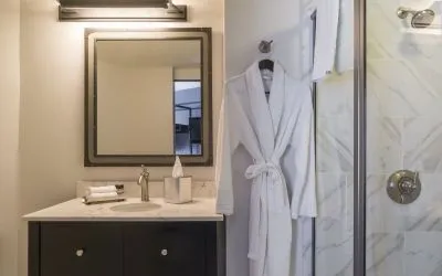 Guest bathroom with shower at The Boxer Boston.