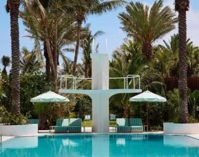 Stylish outdoor pool with lounge chairs at Shelborne South Beach.