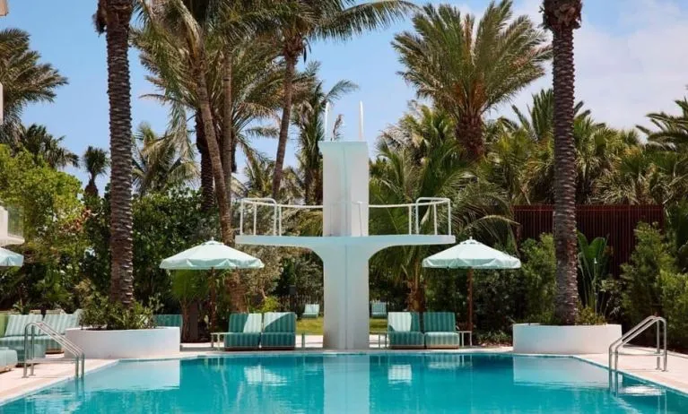 Stylish outdoor pool with lounge chairs at Shelborne South Beach.