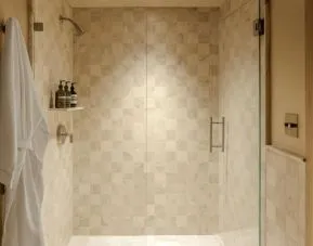 Private guest bathroom with shower and free toiletries at Shelborne South Beach.