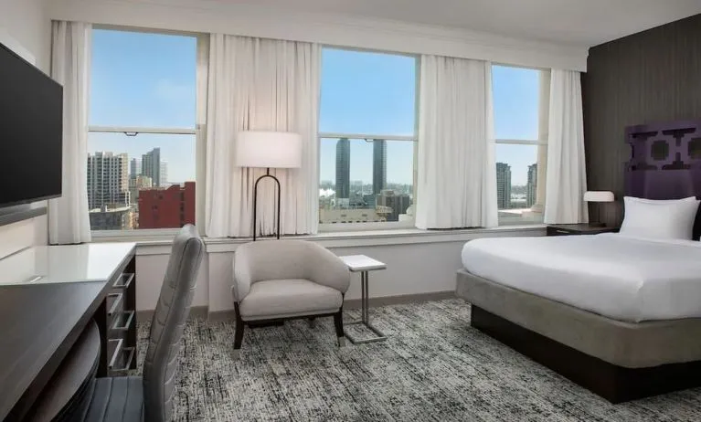 Spacious day use room with work desk and natural light at Courtyard San Diego Downtown.