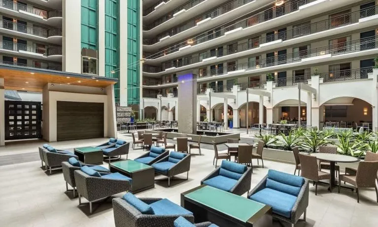 Lobby workspace with comfortable seating at Embassy Suites By Hilton Miami - International Airport.