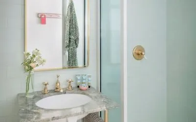 Private bathroom with shower and free toiletries at The Goodtime Hotel.