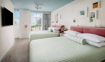Day use twin room with lounge chairs and private bathroom at The Goodtime Hotel.