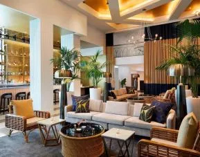 Lobby lounge area and workspace, perfect for co-working at Cadillac Hotel & Beach Club, Autograph Collection.