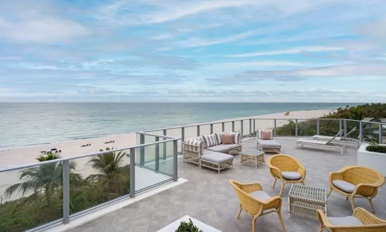 Terrace lounge seating with beautiful view at Cadillac Hotel & Beach Club, Autograph Collection.