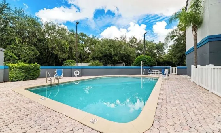 Refreshing outdoor pool at Suburban Studios Orlando - Ocoee/Winter Garden.
