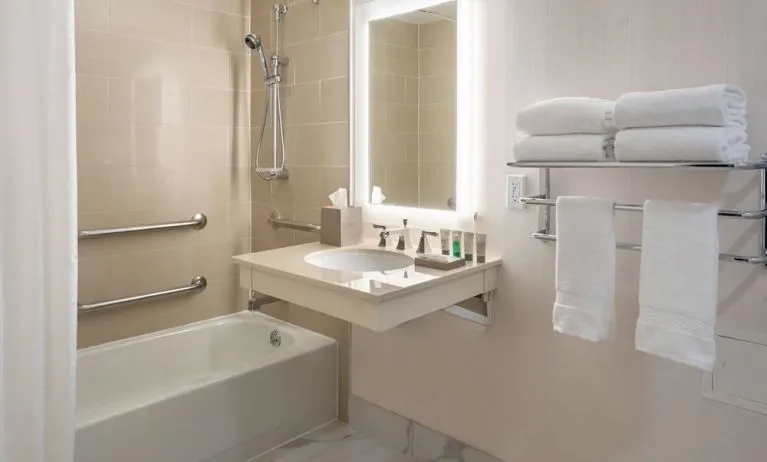 Guest bathroom with shower and tub  at Westin Atlanta Airport Hotel.