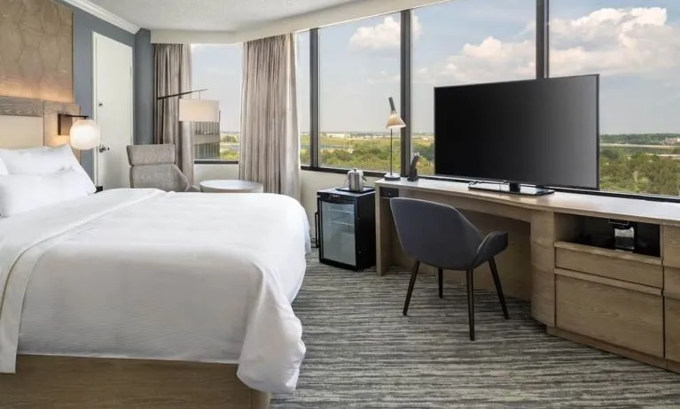 Double bed guest room with panoramic views at Westin Atlanta Airport Hotel.