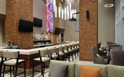 Hotel bar with ample seats at Hilton Garden Inn Calgary Downtown.