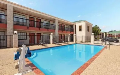 Outdoor pool at Days Inn By Wyndham San Antonio Near Fiesta Park.
