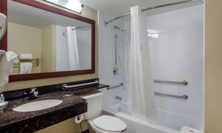 Guest bathroom with shower and tub at Comfort Inn Sandy Springs - Perimeter.
