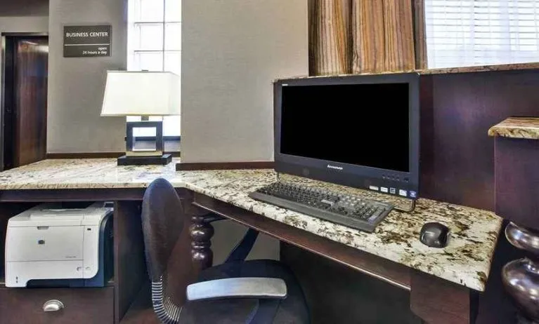 Equipped work station for coworking or individual work Delux king bed with work desk at Hampton Inn Pittsburgh University/Medical Center.