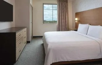 comfortable king bed at Embassy Suites by Hilton Oahu Kapolei.