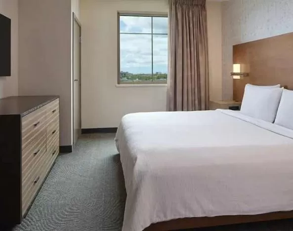 comfortable king bed at Embassy Suites by Hilton Oahu Kapolei.