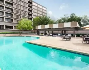 Relaxing outdoor pool area at the DoubleTree Suites by Hilton Houston by the Galleria.