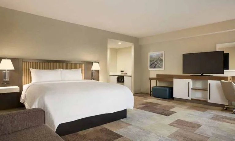 Comfortable king suite with work area at Hampton Inn By Hilton, Salt Lake City Cottonwood.
