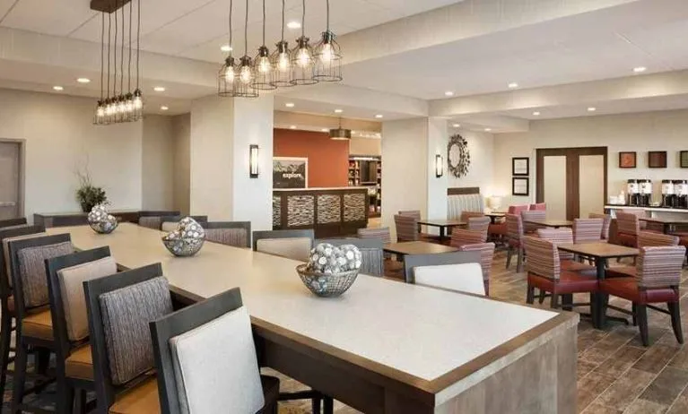 Bright-lit lobby and coworking space at Hampton Inn By Hilton, Salt Lake City Cottonwood.
