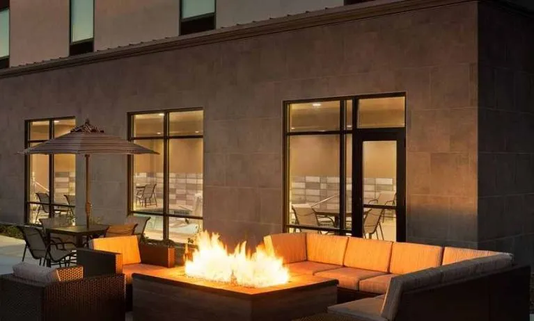 Beautiful outdoor patio with comfortable seating and coworking space at Hampton Inn By Hilton, Salt Lake City Cottonwood.