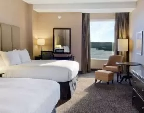 Spacious room with 2 queen beds, work desk and view of the harbour at the Hilton Saint John.