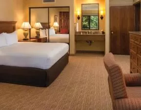 Beautiful king suite with TV screen and desk at the DoubleTree by Hilton Seattle Airport.